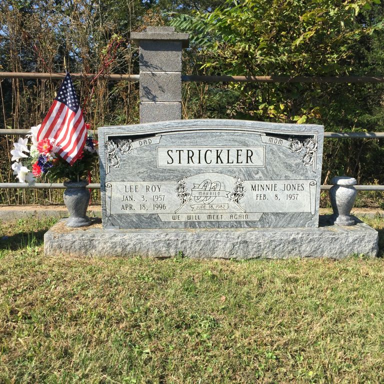 Strickler Cemetery on hill in front of stone house