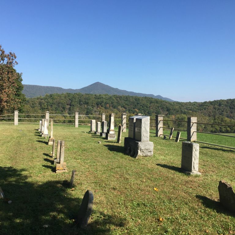 Strickler Cemetery on hill in front of stone house